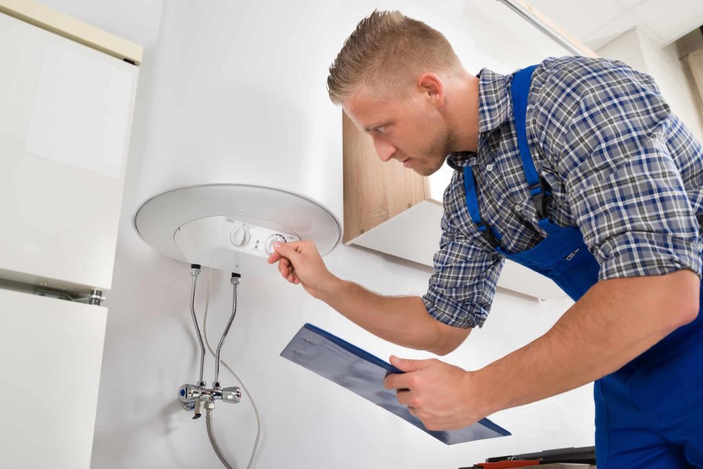 Plumber-Adjusting-Water-Heater